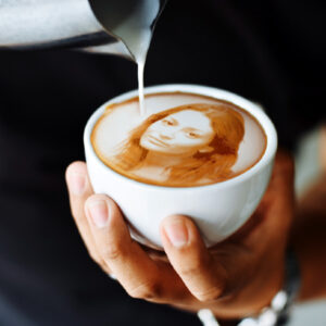 image of coffee foam art, woman's visage in coffee foam