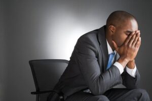 visualizes man in suit stressed out from dehydration