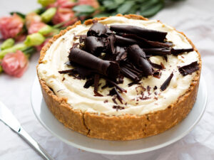 image of banana caramel pie with cream and chocolate shavings